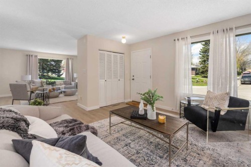 487 Arlington Drive Se, Calgary, AB - Indoor Photo Showing Living Room With Fireplace