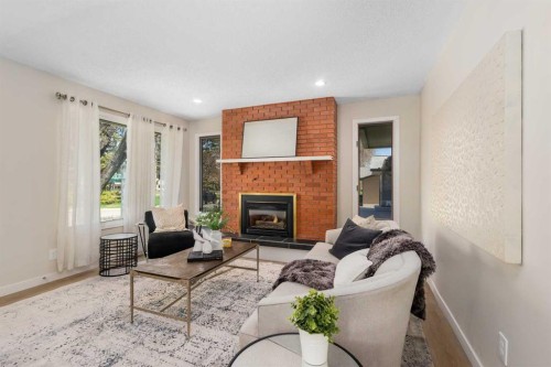 487 Arlington Drive Se, Calgary, AB - Indoor Photo Showing Living Room With Fireplace