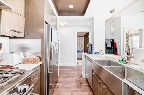 507-10 Shawnee Hill Sw, Calgary, AB - Indoor Photo Showing Kitchen With Double Sink