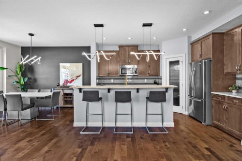 100 Kinniburgh Gardens, Chestermere, AB - Indoor Photo Showing Kitchen With Stainless Steel Kitchen With Upgraded Kitchen