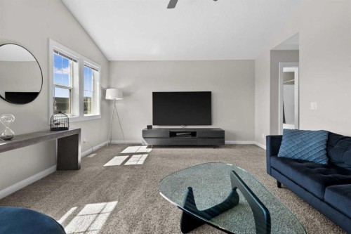 100 Kinniburgh Gardens, Chestermere, AB - Indoor Photo Showing Living Room