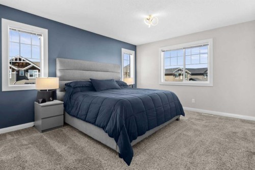 100 Kinniburgh Gardens, Chestermere, AB - Indoor Photo Showing Bedroom