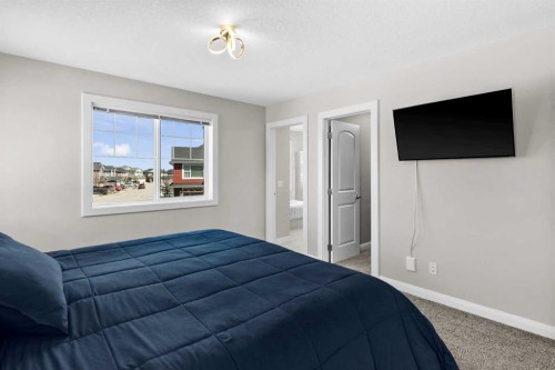 100 Kinniburgh Gardens, Chestermere, AB - Indoor Photo Showing Bedroom