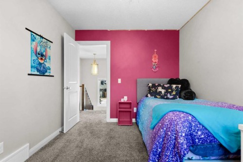 100 Kinniburgh Gardens, Chestermere, AB - Indoor Photo Showing Bedroom