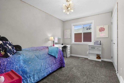 100 Kinniburgh Gardens, Chestermere, AB - Indoor Photo Showing Bedroom