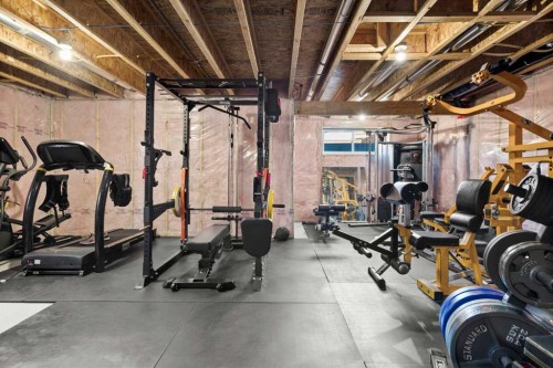 100 Kinniburgh Gardens, Chestermere, AB - Indoor Photo Showing Gym Room