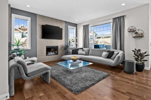 100 Kinniburgh Gardens, Chestermere, AB - Indoor Photo Showing Living Room With Fireplace