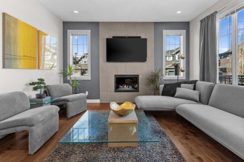 100 Kinniburgh Gardens, Chestermere, AB - Indoor Photo Showing Living Room With Fireplace
