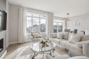 363 Precedence Hill, Cochrane, AB  - Indoor Photo Showing Living Room With Fireplace 