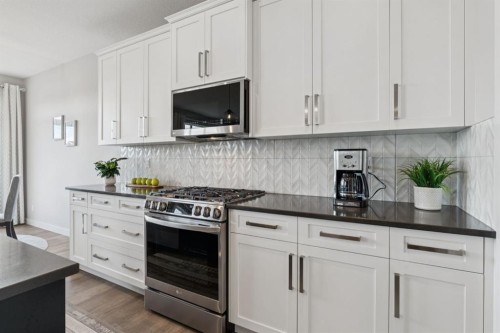 363 Precedence Hill, Cochrane, AB - Indoor Photo Showing Kitchen With Upgraded Kitchen