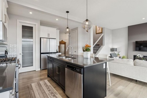 363 Precedence Hill, Cochrane, AB - Indoor Photo Showing Kitchen With Stainless Steel Kitchen With Double Sink With Upgraded Kitchen