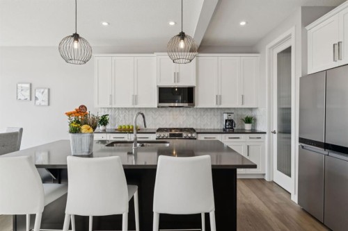 363 Precedence Hill, Cochrane, AB - Indoor Photo Showing Kitchen With Stainless Steel Kitchen With Upgraded Kitchen