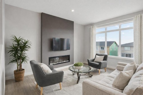 363 Precedence Hill, Cochrane, AB - Indoor Photo Showing Living Room With Fireplace