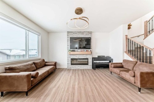 137 Verity Manor Sw, Calgary, AB - Indoor Photo Showing Living Room With Fireplace