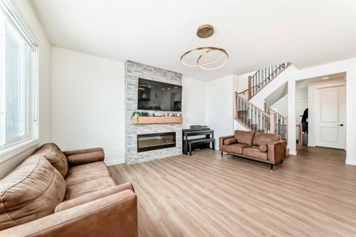 137 Verity Manor Sw, Calgary, AB - Indoor Photo Showing Living Room With Fireplace