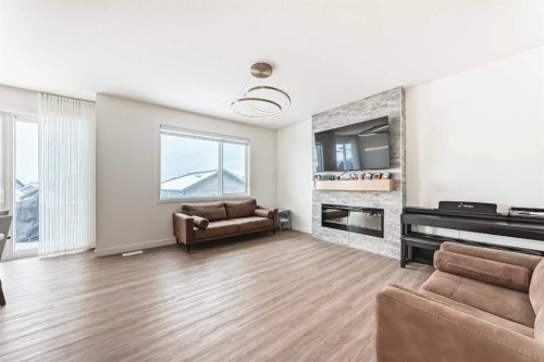 137 Verity Manor Sw, Calgary, AB - Indoor Photo Showing Living Room With Fireplace