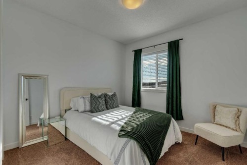 287 Sunset View, Cochrane, AB - Indoor Photo Showing Bedroom