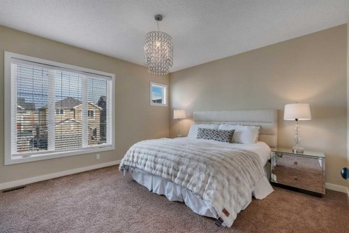 287 Sunset View, Cochrane, AB - Indoor Photo Showing Bedroom