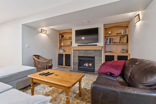 1628 9 Street Nw, Calgary, AB - Indoor Photo Showing Living Room With Fireplace