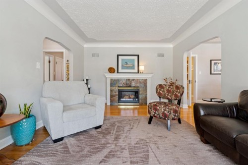 1628 9 Street Nw, Calgary, AB - Indoor Photo Showing Living Room With Fireplace