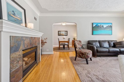 1628 9 Street Nw, Calgary, AB - Indoor Photo Showing Living Room With Fireplace