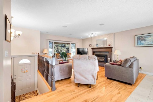 51 Bermondsey Place Nw, Calgary, AB - Indoor Photo Showing Living Room With Fireplace
