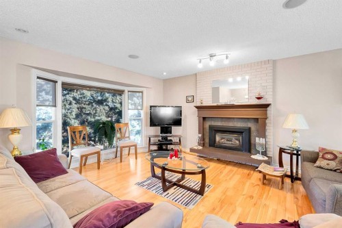 51 Bermondsey Place Nw, Calgary, AB - Indoor Photo Showing Living Room With Fireplace