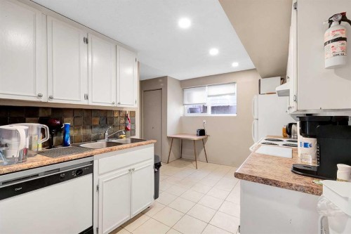 51 Bermondsey Place Nw, Calgary, AB - Indoor Photo Showing Kitchen With Double Sink