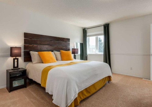 109 Sundown Place Se, Calgary, AB - Indoor Photo Showing Bedroom