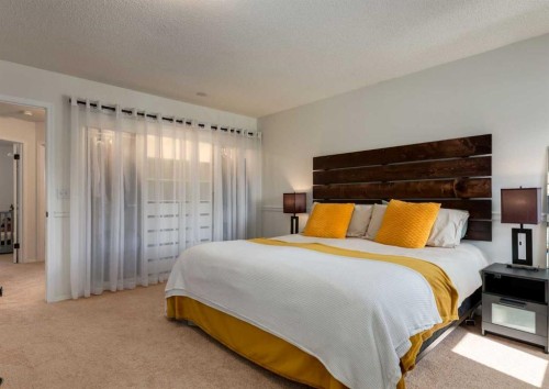 109 Sundown Place Se, Calgary, AB - Indoor Photo Showing Bedroom