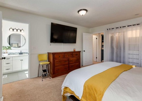 109 Sundown Place Se, Calgary, AB - Indoor Photo Showing Bedroom