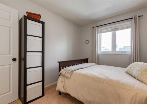109 Sundown Place Se, Calgary, AB - Indoor Photo Showing Bedroom