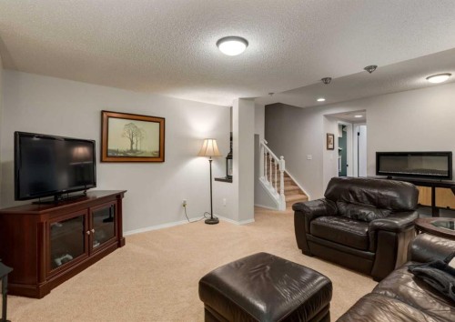 109 Sundown Place Se, Calgary, AB - Indoor Photo Showing Living Room