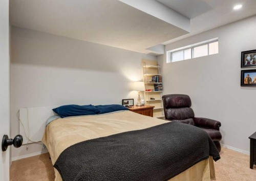 109 Sundown Place Se, Calgary, AB - Indoor Photo Showing Bedroom