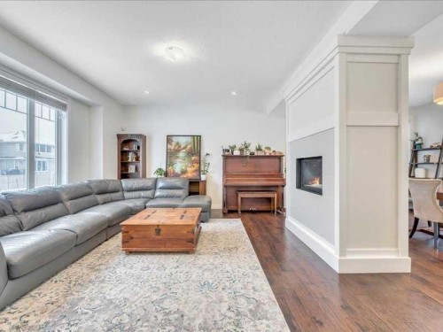 201 Rainbow Falls Glen, Chestermere, AB - Indoor Photo Showing Living Room With Fireplace