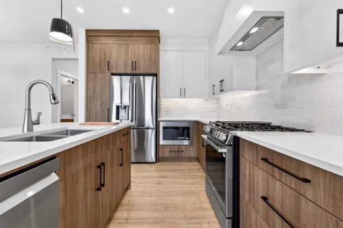 2012 37 Avenue Sw, Calgary, AB - Indoor Photo Showing Kitchen With Double Sink With Upgraded Kitchen
