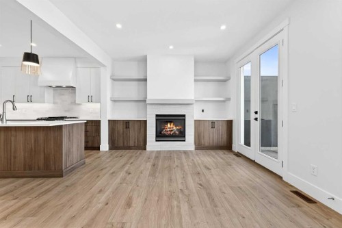2012 37 Avenue Sw, Calgary, AB - Indoor Photo Showing Kitchen With Fireplace