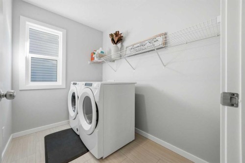 320 Sundown View, Cochrane, AB - Indoor Photo Showing Laundry Room