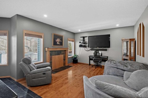 81 Riverwood Crescent Se, Calgary, AB - Indoor Photo Showing Living Room With Fireplace