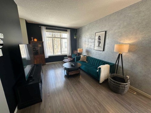 113 Copperpond Row Se, Calgary, AB - Indoor Photo Showing Living Room