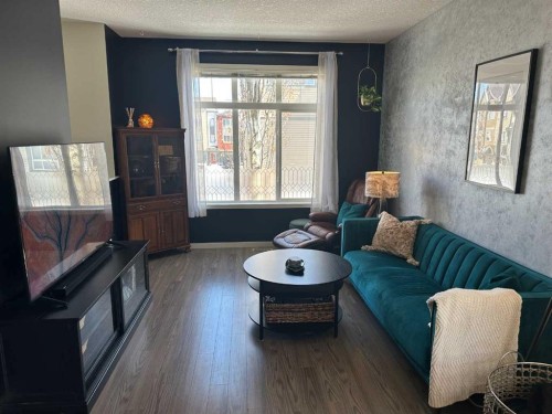 113 Copperpond Row Se, Calgary, AB - Indoor Photo Showing Living Room