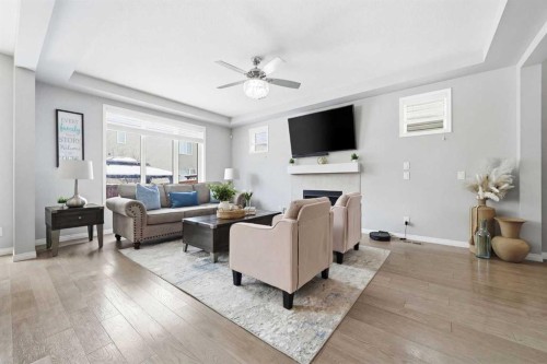 134 Windrow Link Sw, Airdrie, AB - Indoor Photo Showing Living Room With Fireplace
