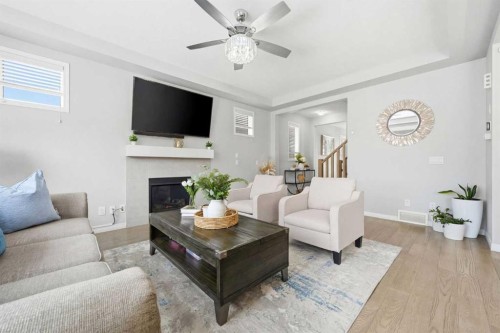 134 Windrow Link Sw, Airdrie, AB - Indoor Photo Showing Living Room With Fireplace