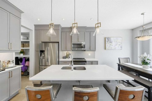 134 Windrow Link Sw, Airdrie, AB - Indoor Photo Showing Kitchen With Stainless Steel Kitchen With Double Sink With Upgraded Kitchen
