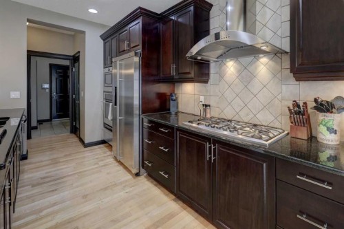 168 Sunset View, Cochrane, AB - Indoor Photo Showing Kitchen With Upgraded Kitchen