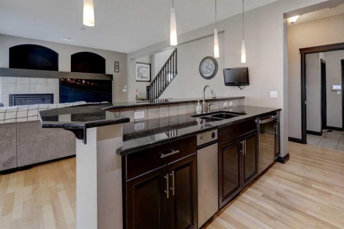 168 Sunset View, Cochrane, AB - Indoor Photo Showing Kitchen With Double Sink