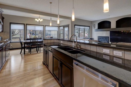 168 Sunset View, Cochrane, AB - Indoor Photo Showing Kitchen With Double Sink