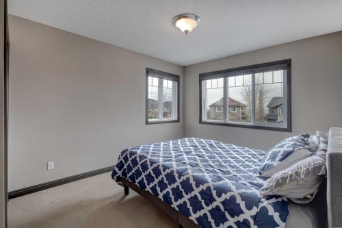 168 Sunset View, Cochrane, AB - Indoor Photo Showing Bedroom