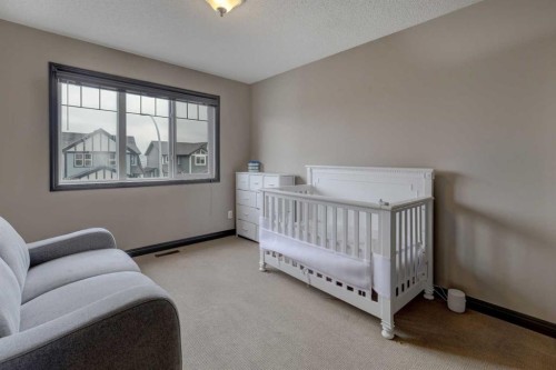 168 Sunset View, Cochrane, AB - Indoor Photo Showing Bedroom