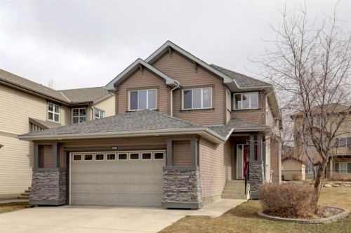 168 Sunset View, Cochrane, AB - Outdoor With Facade